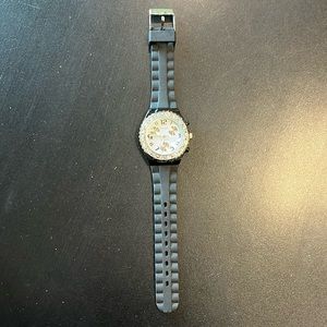 Watch with black rubber band and rhinestones around face